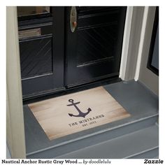 a door mat with an anchor on it