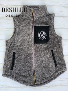 Sherpa Vest, Monogram Sherpa Vest, Monogrammed Sherpa Vest So soft, so cozy...prepare for hugs! Sherpa vests will become a quick favorite in your wardrobe! Choose from 3 different colors: Light Grey Teddy Bear Brown Charcoal/Black *Ivory is sold out Personalization included! The monogram patch area has a nice suede feel. Choose your color of embroidery and customize with your choice of font! Master Circle font will be used if you do not specify another font. Font examples shown: Teddy Bear Vest: Monogrammed Vest, Monogram Vest, Teddy Bear Brown, Grey Teddy Bear, Font Examples, Circle Font, Sherpa Vest, Bear Brown, Sweater Vest Women