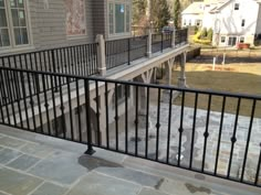 an iron railing on the outside of a house