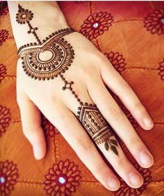 henna tattoo on the palm of a woman's hand