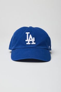 Paneled baseball cap by '47 Brand with a logo embroidered at the front. Features a curved brim & finished with an adjustable strap at the back.Features. Baseball hat from '47 New York Dodgers embroidery Adjustable strap closure Content + Care. 100% Cotton Spot clean Imported Size. Circumference: Adjustable Throwback Adjustable Trucker Baseball Cap, Classic Dad Hat With Logo And Curved Bill, Classic Trucker Hat For Baseball Season With Curved Visor, Classic Trucker Hat For Baseball Season, Classic Curved Visor Snapback Hat For Baseball Season, Classic Dad Hat For Baseball Season, Logo Baseball Cap For Baseball Season, Collegiate Trucker Hat With Curved Brim For Streetwear, Collegiate Streetwear Trucker Hat With Curved Brim