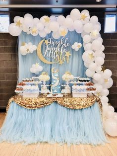 a blue and gold birthday party with balloons