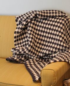 a couch with a blanket on top of it