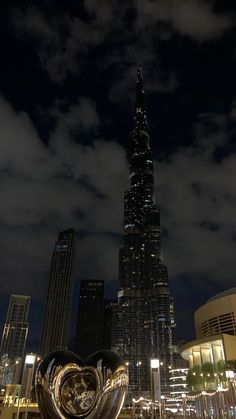 the city skyline is lit up at night