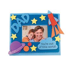 a father's day photo frame with a rocket ship and stars