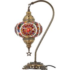 an ornate lamp with a colorful glass ball on it's base and a metal cord