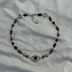 DETAILS: ⋆｡⋆ ☆ obscure eye necklace ✧˖o. brown beaded necklace with silver details and a brown eye charm ₍ᐢ. .ᐢ₎  this is a great unique piece of jewelry<3 i recommend taking it off before swimming or showering 𝜗𝜚 ⊹ ࣪ ˖ *The necklace comes in a cute organza bag packed inside a bubble packaging bag *There are also some stickers, freebies and a little note for you in the package SHIPPING & PROCESSING: *Orders will be shipped from Rhineland-Palatinate via DHL with non-insured shipping (contact me if you want insured shipping but it'll cost more then), I don't assume any liability for lost packages If you have further questions or there's anything wrong with the item you ordered, don't hesitate to contact Bubble Packaging, Brown Beaded Necklace, Rhineland Palatinate, Brown Eye, Brown Necklace, Packaging Bag, Eye Necklace, Bagpack, Organza Bags