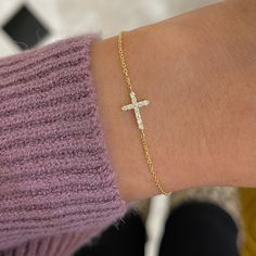 Our Esther Dainty Diamond Cross Bracelet is a glimmering beacon of faith. Stylish and elegant, this bracelet embodies the beauty of His grace. Perfect to shine on its own but sophisticated enough to add to a stack. The intentional delicacy of this design makes for the heartfelt gift of a child's first piece of fine jewelry or an adult's everyday dainty wear. Metal: 18k White Gold / 18k Yellow Gold / 18k Rose Gold Round Brilliant Cut Natural Diamonds: Approx. 0.10 ctw G Color and SI1-2 Clarity Diamonds Length: 7 inches at the longest. ﻿Adjustable sliding bead to provide options for smaller wrist size. Closure: Lobster clasp Measurements: Approx. 11.7mm length x 5.9mm width Looking for a different size? Please email us. Elegant White Cross Bracelets, Elegant White Cross Bracelet, Yellow Gold Sterling Silver Tennis Bracelet As Gift, Fine Jewelry Vvs Clarity Bracelet As Gift, Elegant Adjustable Cross Bracelet, Elegant Cross Rosary Bracelet As Gift, Elegant Rosary Bracelet With Cross For Gift, Elegant Yellow Gold Cross Rosary Bracelet, Elegant Yellow Gold Rosary Bracelet With Cross