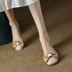 Description
Looking for a sleek and stylish ballet flat that you can wear all year round? Look no further than our nude ballet flats! These beautiful shoes are made from high-quality leather and feature a chic bow detail. They're perfect for everything from the office to a night out on the town. Plus. they come in a versatile nude hue that will go with everything in your wardrobe.

Upper: Leather
Lining: Microfiber
Outsole: TPR
Toe: Round Toe
Closure: Slip on
Color: Nude Beige
made: Yes Nude Ballet Flats, Slingback Flats, Ballet Flat, Bow Detail, Beautiful Shoes, High Quality Leather, Ballet Flats, The Office, Wedding Shoe