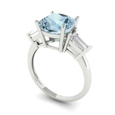 Style: Halo / Solitaire with Accents Stone: Natural Swiss Blue Topaz Main Stone Shape: Round Cut Main Stone Carat Weight: 1.0 Side Stone 1 Shape: Round Cut Side Stone 1 Carat Weight: 0.025 Side Stone 1 Size: 1.8mm Side Stone 1 Quantity: 12.0 Side Stone 2 Shape: Round Cut Side Stone 2 Carat Weight: 0.015 Side Stone 2 Size: 1.5mm Side Stone 2 Quantity: 14.0 Side Stone 3 Shape: Round Cut Side Stone 3 Carat Weight: 0.01 Side Stone 3 Size: 1.3mm Side Stone 3 Quantity: 32.0 Total Carat Weight: 1.83 Nu Blue Moissanite, Wedding Ring Sizes, Blue Tanzanite, Asscher Cut, Gold Engraving, Engagement Ring Sizes, Sky Blue Topaz, Three Stone Engagement Rings, Swiss Blue Topaz