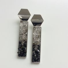 Elegant rectangular shaped art deco style black and silver druzy gold stud earrings.  The druzy features a mix of glass beads in various colours.  The stud is a shiny silver plated hexagon.  These unusual elegant earrings have a drop of approximately 60mm. This design is also available in gold and there is a matching pendant. Please note the display mannequin is not full size and the earrings may appear larger than in real life in the picture.  Please refer to measurements Free shipping to selected countries  These earrings come with a branded gift box Everything in my shop is handmade to order.  Expect first class customer service, next day despatch, free first class postage in the UK, free shipping elsewhere, no quibble returns (please see my policy) All orders are presented in either a