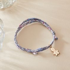 For a little one who loves to match with mommy, our Children’s Personalized Boy Liberty Bracelet is the perfect gift for a birthday, christening or milestone moment. Each bracelet can be personalized to capture their unique personality, with a choice of five colourful Liberty braid prints and their name hand-engraved onto the mini boy charm.18K Champagne Gold Plated, 925 Sterling Silver or 18K Rose Gold PlatedMini Boy: &nbsp;0.47 x 0.31Liberty braid with fully adjustable sliding knot fasteningHand-engraved in our Paris workshopSent with love in a complimentary gift boxAny slight variations in lettering depth, spacing and alignment from the examples shown are part of the aesthetic and originality of the pieceChildren’s Warning: please note, this piece of jewelry is not a toy. We advise Adjustable Birth Flower Bracelet For Birthday, Adjustable Name Bracelet With Charms For Birthday, Personalized Blue Charm Bracelet For Birthday, Blue Name Bracelet For Mother's Day Gift, Mother's Day Blue Name Bracelet Gift, Adjustable Charm Bracelet For Gifts, Adjustable Charm Bracelet For Personalized Gift, Blue Friendship Bracelets For Mother's Day Gift, Blue Bracelets For Mother's Day Personalized Gift