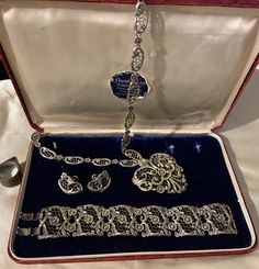 "Beautiful Sterling Danecraft set includes bracelet, necklace & earring. The pattern is Florentine Lace. Original box is also included.  The necklace is 21\" end to end. The heart pendant is 2 1/4\" x 2 1/4\".  The bracelet is 7 1/4\" x 1 1/4\". Screwback earrings are 1\".  Total weight is 136 grams.  Rare find!  Condition is excellent." Evening Jewelry In Sterling Silver With Intricate Design, Elegant Filigree Jewelry Sets, Antique Hallmarked Jewelry For Evening, Ornate Filigree Jewelry For Evening, Art Deco Jewelry With Intricate Design For Formal Events, Art Deco Filigree Jewelry For Evening, Victorian Engraved Jewelry For Evening, Elegant Filigree Necklaces For Valentine's Day, Elegant Formal Jewelry With Filigree Detail