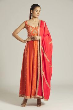 Tan orange anarkali with floral woven pattern panels, overlap jacket panel, contrast zardozi and aari embroidered yoke. Paired with contrast red embroidered dupatta with metallic border. - Aza Fashions Orange Chanderi Lehenga With Resham Embroidery, Designer Wear Orange Silk Lehenga, Designer Orange Silk Lehenga, Orange Silk Lehenga For Designer Wear, Orange Chanderi Sharara For Reception, Orange Sharara With Resham Embroidery For Reception, Orange Anarkali Set For Reception And Festivals, Orange Chanderi Lehenga With Cutdana, Chanderi Choli In Orange For Receptions