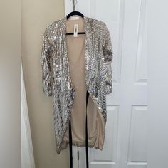 Shop sb08242's closet or find the perfect look from millions of stylists. Fast shipping and buyer protection. Never worn! Tags on! Ziela brand Party and special occasion sequin cardigan jacket. Metallic Sequined Outerwear For Party, Metallic Sequined Party Outerwear, Metallic Sequin Party Outerwear, Metallic Winter Party Outerwear, Metallic Outerwear For Winter Party, Metallic Outerwear For Party In Winter, Metallic Outerwear For Fall Party, Glamorous Metallic Outerwear For Party, Silver Sequined Winter Outerwear