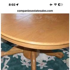 a wooden table sitting on top of a carpeted floor