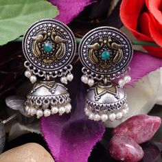 These stylish Jhumki Earrings set from will  makzekshop certainly leave you spellbound.  This is a Beautiful Oxidized Silver and Gold (Double Tone) Polish Jhumka Pair, This Pair includes perfectly designed danglers, These Jhumki Earrings set have an excellent finish and gives out an exquisite sense of style. If you are looking for an amazing Fashion Jewelry set for special occasions such as Anniversary, Engagement, Party, Wedding or for gifting , then your search ends here. Item Description: The Dual-tone Metal Earrings For Festivals, Multicolor Metal Jhumkas With Latkans, Multicolor Dual-tone Earrings For Festivals, Dual-tone Green Earrings As Gift, Bohemian Dual-tone Earrings As Gift, Festive Bohemian Dual-tone Earrings, Dual-tone Earrings For Navratri Celebration, Dual-tone Drop Jhumkas As Gift, Dual-tone Earrings For Gift Occasion