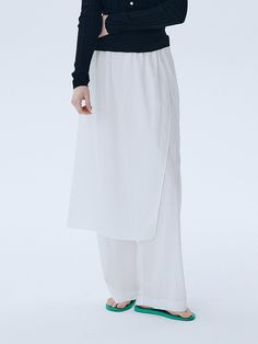 This is a modern and unique pants with skirt by ahwe that is made out of high quality and sturdy fabric. With minimal design detail and trendy mood, you can style it for your casual and refined daily outfit.- Elastic waistband- Skirt layered on top of the pants- Relaxed wide silhouette White Relaxed Cotton Skirt, White Relaxed Fit Cotton Skirt, Modern White Ankle-length Wide Leg Pants, Modern Cotton Bottoms For Daywear, Versatile White Bottoms With Elastic Waistband, White High-waisted Culottes For Work, Chic Relaxed Skirt For Daywear, Versatile High-waisted White Wide Leg Pants, Versatile Daywear Relaxed Skirt