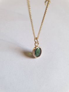 This minimalist Green Tourmaline, solid gold necklace was designed with a bottle green see through pendant, to beautifully accompany you through your busy days. The classic simple design is always pretty for day and evening, work or fun. The gold Tourmaline necklace is handmade and delicate and available both with a 9kt or a 14 karat pendant. The solid gold chain is made of 14k and available in a of couple lengths. The clear Green Tourmaline necklace is a perfect chic and elegant gift. The penda Gold Emerald Birthstone Necklace In Minimalist Style, Gold Minimalist Emerald Birthstone Necklace, Minimalist Gold Emerald Birthstone Necklace, Minimalist Gold Emerald Necklace In Sterling Silver, Minimalist Green Necklace For May Birthstone, Delicate Green Necklace For Everyday Wear, Green Minimalist Gemstone Birthstone Necklace, Minimalist Green Emerald Necklace For Everyday, Minimalist Green Charm Necklace For Everyday Wear