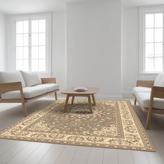 a living room with two couches and a coffee table in the middle of it