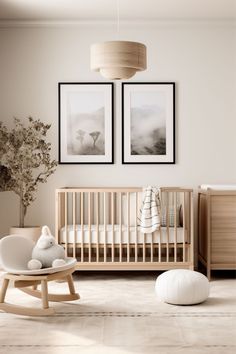 a baby's room with two pictures on the wall