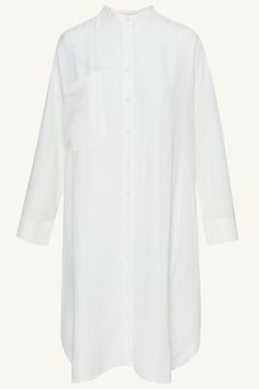 Elevate your summer wardrobe with our luxurious Linen Longline Button Down Top in White. Crafted from cool and breezy linen, this tunic-length cover up is perfect to wear as a standalone piece or a stylish layering option. Embrace effortless elegance in our white button down top. Model is 5'7" and is wearing size XS. Summer Tunic Blouse With Buttons, Chic Linen Dress With Buttons For Beach, Vacation Linen Blouse With Long Sleeves, Linen Long Sleeve Blouse For Vacation, Long Sleeve Linen Blouse For Vacation, Chic Button-up Tunic For Spring, Chic Spring Button-up Tunic, Chic Linen Tunic For Vacation, Summer Linen Dress With Button Cuffs For Daywear