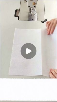 someone is holding up a piece of paper with the video below it to show what they are doing