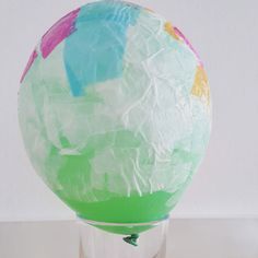 a paper mache ball sitting on top of a table