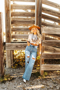 A cowgirl can never have too many pairs of jeans! These High Waisted Wide Leg Distressed Jean have rips in all the right places. Get ready to layer on your favorite graphic tee and shacket to complete the ultimate boho chic fit! Cowboy Boho Outfit, Festival Outfits Western, Cute Western Outfits Women, Cowgirl Style Outfits Rodeo, Western Style Outfits Cowgirl Chic, Western Concert Outfit, Rodeo Outfits For Women, Western Chic Outfits, Western Pics