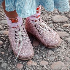 "Rose Baby Co shoes are designed with comfort and cuteness in mind.   Made from gorgeous pink, gold and sliver chunky glitter outside and a soft faux leather inside .  The hard soles are skid resistant rubber sole, and soft soles are a soft, skid resistant suede. Our shoes are great for developing feet.  Our lace up boots have a curved toes for comfort and wiggle room.  I work very closely with a small  handmade shoe manufacturer to create the perfect look and each shoe has my Rose Baby Co logo Cute Pink Booties With Rubber Sole, Casual Glitter Boots With Round Toe, Glitter Boots With Round Toe, Pink Spring Booties With Round Toe, Spring Pink Booties With Round Toe, Winter Glitter Print Boots With Round Toe, Cute Pink Round Toe Booties, Winter Boots With Glitter Print And Round Toe, Spring Boots With Glitter Accents And Round Toe