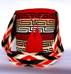 Mochila purse made by artisans of the Wayuu Indigenous Group in Colombia Purchased directly from Artisan, on a Fair Trade Basis Fully Handmade For each Wayuu Mochila Bag purchased, Hands of Colombia donates thread to Indigenous Artisans. Only ONE available Wayuu Mochila Purses are famous for their stunning designs and unique character. Each purse is handmade, full of expression and character. SIZE - Large. 12 inches deep (30.5cm), 13 inches wide (33cm). Comfortably fits large items: use as an ev Traditional Bucket Shoulder Bag As Gift, Handmade Red Bucket Bag For Travel, Handmade Red Bucket Crochet Bag, Red Handmade Crochet Bucket Bag, Handmade Red Crochet Bucket Bag, Artisan Woven Shoulder Bag As Gift, Artisan Woven Shoulder Bag Gift, Artisan Weaving Bag Perfect For Gifts, Artisan Weaving Bags For Gifts