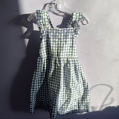 Brand New Dress Never Worn Blue Cotton Dress For Dress-up, Spring Gingham Cotton Sundress, Blue Sleeveless Dress For Picnic, Playful Gingham Dress For Spring, Beach Gingham Cotton Dress, Blue Summer Cotton Dress, Spring Playful Gingham Dress, Blue Cotton Short Sleeve Sundress, Blue Cotton Sundress With Short Sleeves