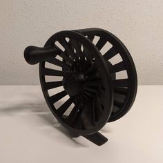 a black reel on a white table