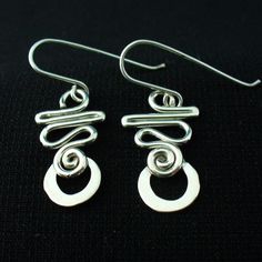 These earrings are hand crafted in solid sterling silver.I use 16 gauge wire for these so they're nice and light but not flimsy.For a unique,long lasting and clearly handmade pair of everyday dangles that won't break the bank.These will do the trick. Everyday Hypoallergenic Sterling Silver Linear Earrings, Adjustable Sterling Silver Hoop Earrings With Ear Wire, Unique Sterling Silver Pierced Wrap Earrings, Unique Sterling Silver Wrap Earrings, Minimalist Sterling Silver Linear Earrings Nickel-free, Modern Sterling Silver Nickel-free Linear Earrings, Minimalist Sterling Silver Nickel-free Linear Earrings, Nickel-free Sterling Silver Earrings, Minimalist Nickel-free Sterling Silver Linear Earrings