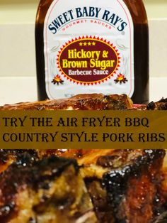 a bottle of brown sugar next to ribs on a counter top with the words try the air fryer bbq country style pork ribs