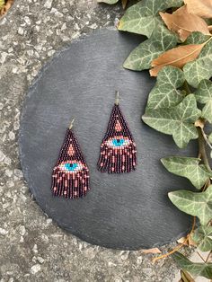 Bronze Evil eye beaded fringe earrings seed bead earrings dangle boho earrings chandelier earrings native bead earrings evening earrings bohemian Dᴏ ʏᴏᴜ ʙᴇʟɪᴇᴠᴇ ɪɴ ᴛʜᴇ ᴇᴠɪʟ ᴇʏᴇ? Wᴇ ʙᴇʟɪᴇᴠᴇ! :) ♥𝑇ℎ𝑒 𝑝𝑎𝑡𝑡𝑒𝑟𝑛 𝑜𝑓 𝑡ℎ𝑖𝑠 𝑒𝑎𝑟𝑟𝑖𝑛𝑔 ℎ𝑎𝑠 𝑏𝑒𝑒𝑛 𝑐𝑟𝑒𝑎𝑡𝑒𝑑 𝑡𝑜 𝑝𝑟𝑜𝑡𝑒𝑐𝑡 𝑦𝑜𝑢 𝑓𝑟𝑜𝑚 𝑡ℎ𝑒 𝑒𝑣𝑖𝑙 𝑒𝑦𝑒 𝑎𝑛𝑑 𝑐𝑟𝑒𝑎𝑡𝑒𝑑 𝑏𝑦 𝐻𝑊𝐵𝑒𝑎𝑑𝐽𝑒𝑤𝑒𝑙𝑟𝑦.  ♥𝑀𝑎𝑑𝑒 𝑢𝑠𝑖𝑛𝑔 𝑓𝑟𝑒𝑒ℎ𝑎𝑛𝑑 𝑏𝑒𝑎𝑑𝑖𝑛𝑔 𝑤𝑜𝑣𝑒𝑛 𝑡𝑒𝑐ℎ𝑛𝑖𝑞𝑢𝑒𝑠 𝑤𝑖𝑡ℎ 𝑠𝑡𝑟𝑜𝑛𝑔 𝑠𝑦𝑛𝑡ℎ Witchy Beaded Earrings, Seed Bead Jewelry Patterns, Evening Earrings, Beaded Fringe Earrings, Earrings Chandelier, Brick Stitch Pattern, Light Earrings, Earrings Bohemian, Beaded Fringe