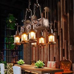 a chandelier hanging over a dining room table