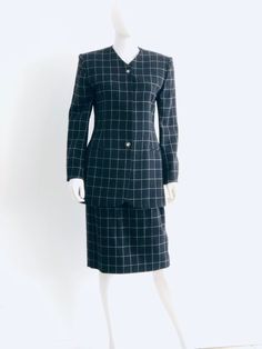 "Sophisticated vintage 1980s black and white windowpane check skirt suit by Jones NY in pure wool. Jacket features a four button front closure, 2 hidden behind front placket; smart black and gold colored dimensional buttons at front closure and at cuffs; and 2 front faux pockets. Skirt features a two button back and zipper closure. Fully lined. Approximate Measurements: Jacket: Chest: 37\"; Shoulder: 16 1/2\"; Waist: 33\"; Hips: 39\"; Length: 30 1/2\" Skirt: Waist: 26\"; Hips: 38\"; Length: 26 1 Classic Winter Skirt Suit For Career, Classic Black Business Skirt Suit, Classic Black Skirt Suit For Business, Fall Business Skirt Suit, Check Jacket, Check Skirt, Checkered Skirt, Checked Jacket, Cool Sweaters