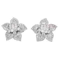 Brilliant 10.50ct Diamonds Stud Earrings in 14k White Gold - IGI Certified Experience dazzling brilliance with these exceptional 14K white gold diamond stud earrings. Showcasing 22 round-cut diamonds totaling 5.87 carats, surrounded by 120 smaller round-cut diamonds weighing 4.63 carats, these earrings are a masterpiece of luxury. The combination of these round-cut diamonds creates a mesmerizing halo effect, amplifying the overall sparkle and radiance of these earrings. Metal: 14k White Gold Main stone: 22 pcs Diamonds Main stone carat weight: 5.87ct Shape: Round Color grade: E-F Clarity grade: SI1-I1 Cut grade: Good Side stone: 120 pcs Diamonds Side stone carat weight: 4.63ct Shape: Round Color grade: E-F Clarity grade: SI1-I1 Cut grade: Good Total carat weight: 10.50ct Total jewelry weig Gold Diamond Stud Earrings, Dressy Hats, Gold Diamond Earrings Studs, Earrings Metal, Diamond Stud Earrings, Diamond Stud, Round Cut Diamond, White Shoes, Diamond Earrings Studs