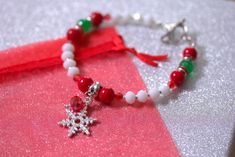 Christmas bracelet, Natural gemstone and czech glass bead mix bracelet, Red green and white colours representing Christmas, Tibetan silver snowflake charm and silver tone details Tibetan silver heart shape toggle clasp Bracelet length is 7.5''  (19cm), NOT adjustable! Organza bag included! Perfect Christmas gift for Her! :) You can also get a gift box for an extra £1,  find it in jewellery listings :) Red Jade Bracelet, Snowflake Bracelet, Snowflake Jewelry, Pink Tassel Earrings, Red Beaded Bracelet, Blue Beaded Bracelets, Beaded Tassel Earrings, Red Bracelets