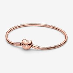 Make your story shine with the Pandora Moments Heart Clasp Snake Chain Bracelet. Our iconic snake chain bracelet gets a gleaming update in 14k rose gold plating, with a polished heart-shaped clasp. The clasp includes an engraved Pandora logo on one side and the Pandora Crown O logo on the other. Style this Pandora snake chain bracelet with up to 16 to 18 charms for an iconic everyday look that is all yours. - Pandora Moments Heart Clasp Snake Chain Bracelet - 14k Rose gold-plated unique metal blend - Sz. 9.1 in Pandora Logo, Snake Chain Bracelets, Mesh Bracelet, Top Gifts, Snake Chain, Bracelet Sizes, Christmas List, Gold Plating, Sterling Silver Bracelets