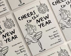 several new year's cards with black ink on white paper, each featuring an image of a woman holding a wine glass