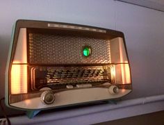 an old radio sitting on top of a shelf