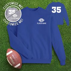 Football pocket graphic with your child's custom number inside, and name underneath. Along with number on the back, jersey style, on the sweatshirt. Child's name and football number on front and back are customizable! Graphic color varies on sweatshirts. Custom football mom gear to keep you warm at all your player's games! Graphic color varies on sweatshirts. Personalization: 1. Type the color of graphic that you would like. Choice of Black or White ONLY. 2. Player's Name. (Capitalization counts) 3. Player's Number. Adult Sizes S-XXL (unisex sizing) Gildan 18000 Heavy Blend, Port & Co, Jerzzees (availability varies) 50/50 cotton/polyester Classic, unisex fit 1x1 rib with spandex Shipping || All orders over $35 ship for free! We will combine shipping and refund for any shipping overages. Or White Football Season Sweatshirt With Letter Print, Football Season Team Name Sweatshirt, Team-colored Graphic Print Sweatshirt For Football Season, Football Season Custom Print Crew Neck T-shirt, Football Season Fan Apparel T-shirt With Name Print, Football Numbers, Football Names, Heather Grey Sweatshirt, Jersey Style