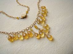 Sale, $40 off.  Handmade, luxury, wire wrapped, golden Citrine gemstone necklace in gold.  Warm, yellow citrines (natural , untreated, faceted, almost transparent gemstones) carefully hand were wire wrapped to 14 k gold filled wire and suspended on 14 k gold fill chain. You will get the same as on the photo necklace.The necklace is 16 inches long, it can be adjusted per request. I can add an extender for you. Genuine, untreated, raw Citrine briolettes are 9 x 6  mm each.   All metal parts are 14 Luxury Yellow Gold Beaded Gemstone Necklaces, Luxury Yellow Beaded Necklace For Gift, Luxury Yellow Gold Beaded Necklace For Gifting, Luxury Gold Citrine Necklace, Elegant Gold Citrine Necklace, Elegant Gold Jewelry With Yellow Sapphire, Elegant Gold Yellow Sapphire Jewelry, Elegant Amber Jewelry With Yellow Sapphire, Amber Yellow Sapphire Elegant Jewelry