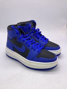 Elevate your sneaker game with these Nike Air Jordan 1 High shoes in Hyper Royal color. The shoes feature a lace-up closure and a high-top shoe shaft style for a secure and comfortable fit. They are perfect for casual wear and various activities such as walking, school, cross training, CrossFit, basketball, and running. These shoes are made with high-quality synthetic upper material and a blended fabric for the lining material. The rubber outsole provides excellent traction, and the foam insole ensures a cushioned feel. The shoes come in women's sizes 7-10 and have a solid pattern with colorful accents and the Air Jordan logo. Air Jordan 1 Elevate High, Jordan 1 Elevate High, Jordan 1 Elevate, High Top Shoe, Jordan Logo, Royal Colors, High Shoes, Sneaker Games, Nike Air Jordan 1