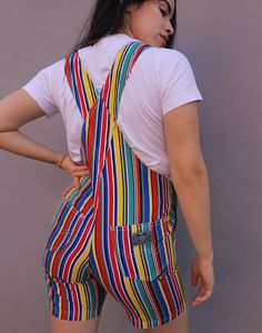 Vintage dungaree shorts in a multi colour stripe. Single chest pocket. Front and back lower pockets. Adjustable shoulder straps. Size small, UK 6-8 / EUR 34-36. Measurements - 7"(18cm) bib height - 13"(33cm) bib width - 28"(71cm) waist - 34"(87cm) hips - 7"(18cm) inner leg. Material - Cotton. Condition - Excellent. Handpicked, repaired and ready to wear. This is an original vintage item, not new and minor signs of wear & age are expected, we will highlight any major flaws.Model is a UK 8 and is 5'6" tall. Striped Overalls With Pockets For Summer, Summer Striped Cotton Overalls, Casual Striped Overalls With Pockets, Dungaree Shorts, Womens Denim Overalls, Overalls Denim, Dungarees Shorts, Womens Denim, Denim Romper