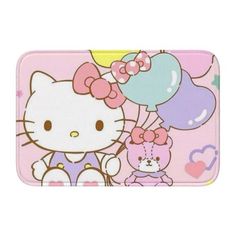 a hello kitty bath mat with balloons on it