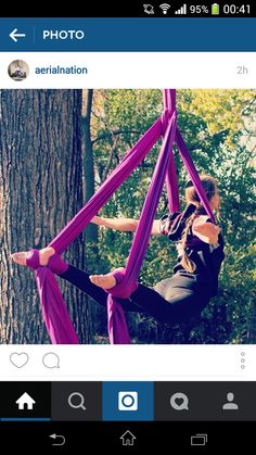 a woman is sitting in a hammock with her legs spread out and feet crossed