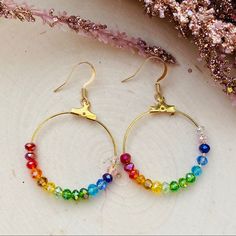 Beautiful Unique Design Handmade Hoop Earrings Made With Rainbow Swarovski Crystals On 18k Gold Plated Earrings Colorful Lightweight Earrings Perfect For Any Occasion Hypoallergenic Rainbow Hoop Earrings As Gift, Rainbow Hypoallergenic Hoop Earrings, Hypoallergenic Rainbow Hoop Earrings, Hypoallergenic Rainbow Round Earrings, Nickel-free Small Hoop Rainbow Earrings, Rainbow Hoop Earrings With Ear Wire As Gift, Rainbow Round Earrings For Pierced Ears, Everyday Rainbow Round Jewelry, Rainbow Hoop Earrings With Ear Wire For Gift